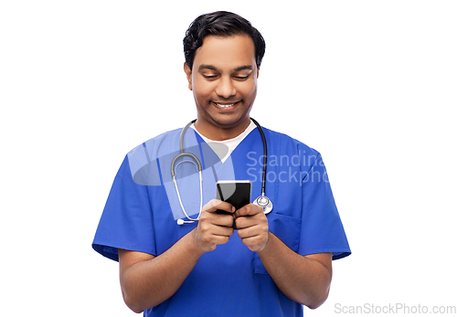 Image of smiling doctor or male nurse using smartphone