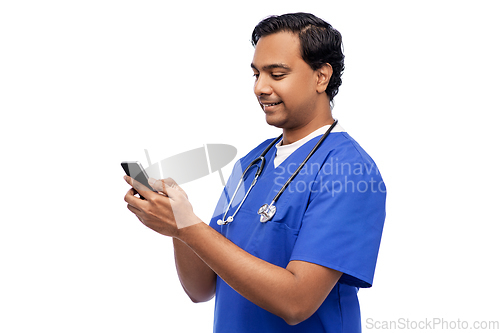 Image of smiling doctor or male nurse using smartphone