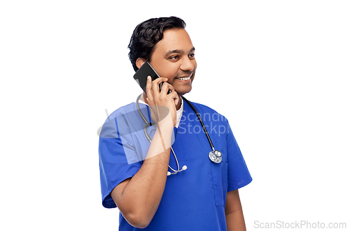 Image of smiling doctor or male nurse calling on smartphone