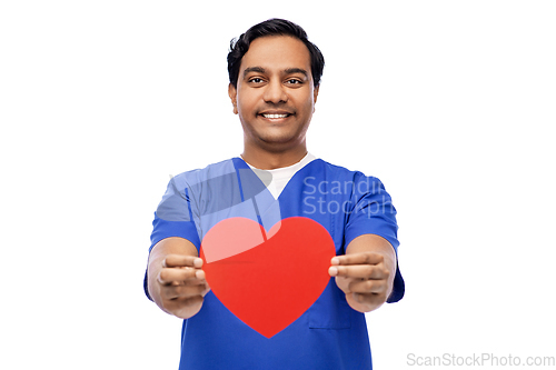 Image of smiling male doctor with red heart on clipboard