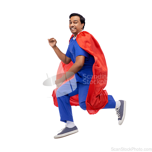 Image of doctor or male nurse in superhero cape jumping