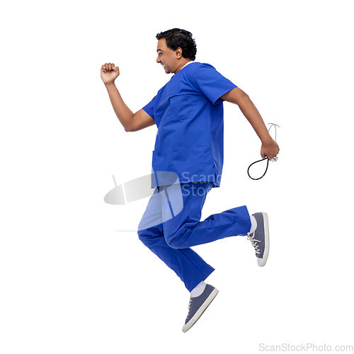 Image of doctor or male nurse with stethoscope jumping