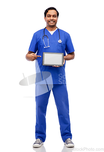 Image of happy doctor or male nurse showing tablet computer