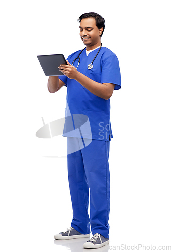 Image of smiling doctor or male nurse using tablet computer