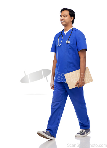 Image of male doctor walking with clipboard and stethoscope