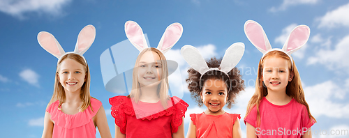 Image of happy girls wearing easter bunny ears headbands