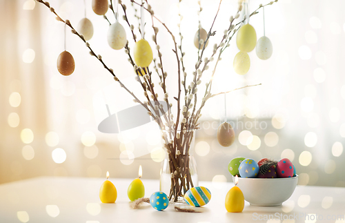 Image of pussy willow branches decorated by easter eggs