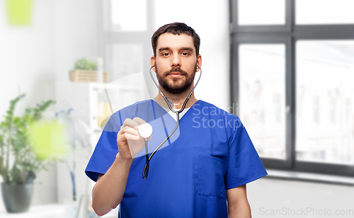 Image of doctor or male nurse with stethoscope