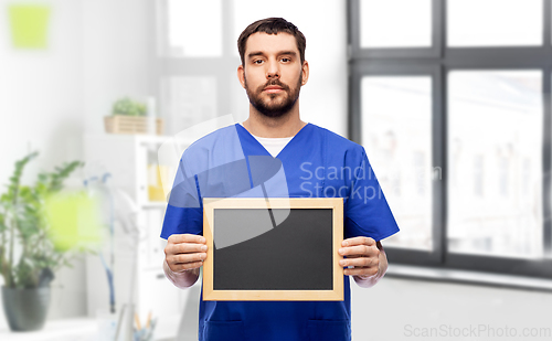 Image of male doctor or nurse with chalkboard