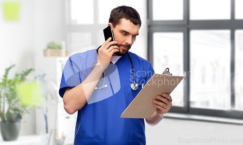 Image of doctor or male nurse calling on smartphone