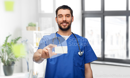 Image of doctor or male nurse with medicine and stethoscope