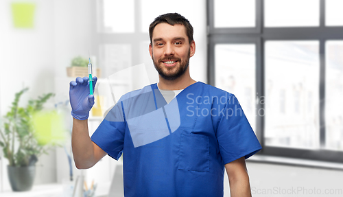 Image of doctor or male nurse with medicine in syringe