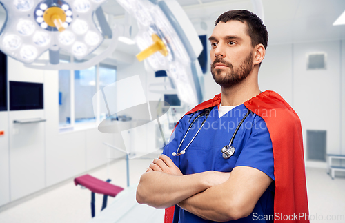 Image of doctor or male nurse in superhero cape at hospital