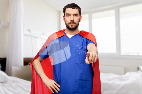 Image of male doctor in superhero cape pointing to you