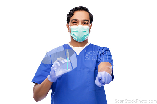 Image of indian male doctor in mask with vaccine in syringe