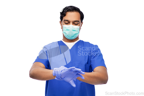 Image of indian male doctor in uniform, mask and gloves