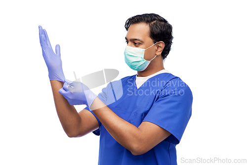 Image of indian male doctor in uniform, mask and gloves