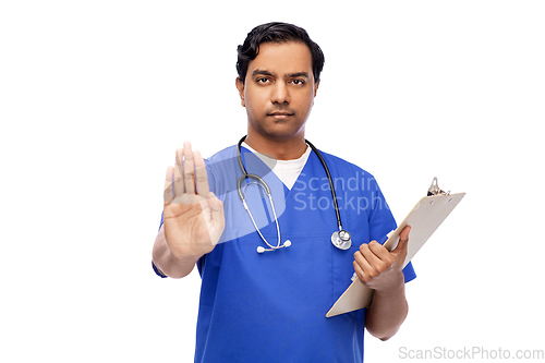 Image of indian doctor or male nurse showing stop gesture