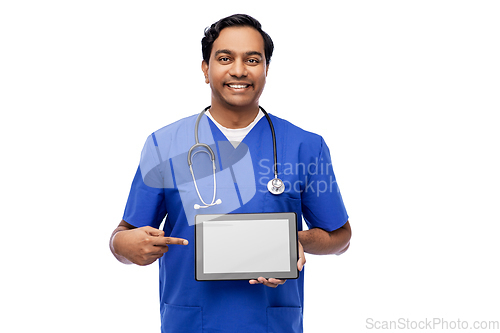 Image of happy doctor or male nurse showing tablet computer