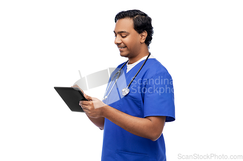 Image of smiling doctor or male nurse using tablet computer