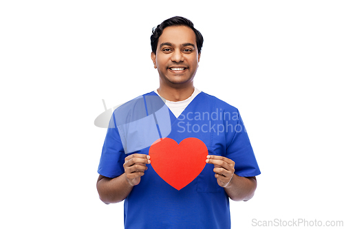 Image of smiling male doctor with red heart on clipboard