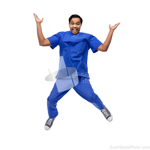 Image of doctor or male nurse with stethoscope jumping