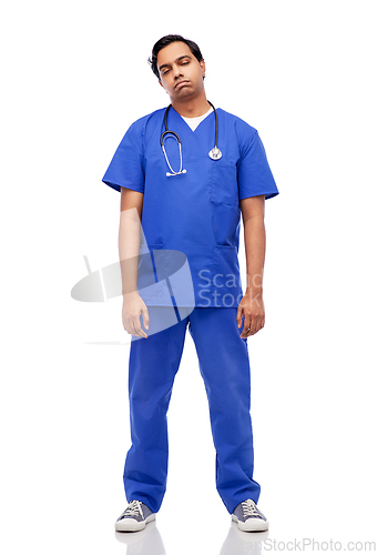 Image of tired indian doctor or male nurse in blue uniform