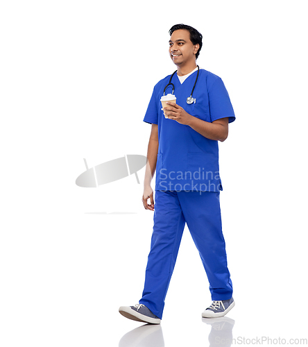 Image of male doctor walking with coffee and stethoscope