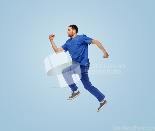 Image of doctor or male nurse jumping in air