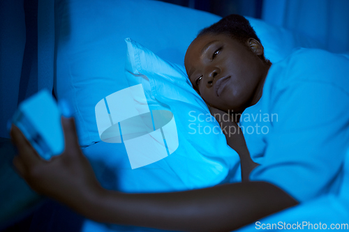 Image of woman awaking because of alarm clock at night