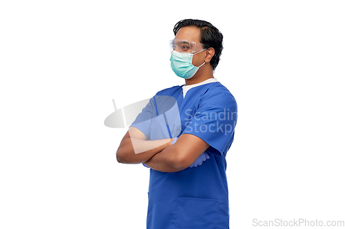 Image of indian male doctor in blue uniform and mask