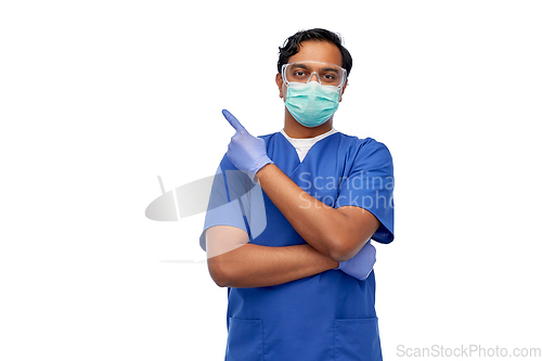 Image of indian male doctor in mask showing something