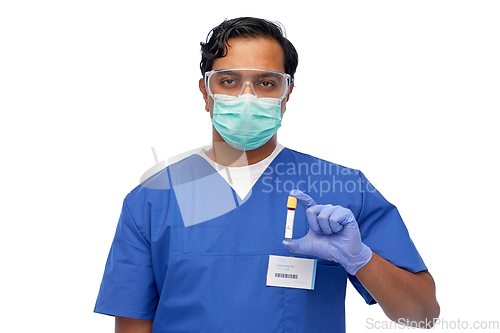 Image of indian male doctor in mask with blood in test tube