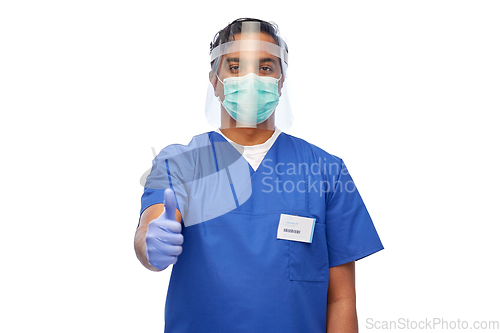 Image of doctor in mask and face shield showing thumbs up