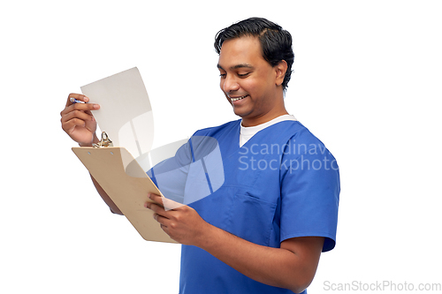 Image of happy indian male doctor with clipboard