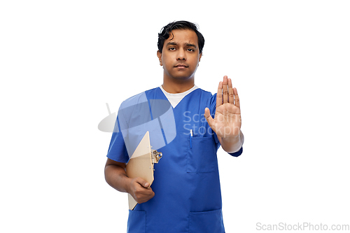 Image of indian doctor or male nurse showing stop gesture