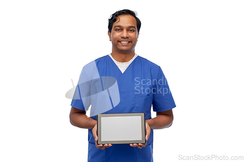 Image of happy doctor or male nurse showing tablet computer