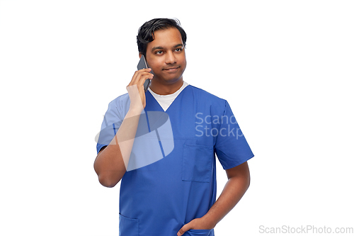 Image of smiling doctor or male nurse calling on smartphone