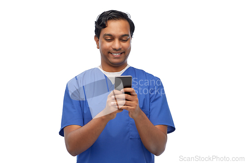 Image of smiling doctor or male nurse using smartphone