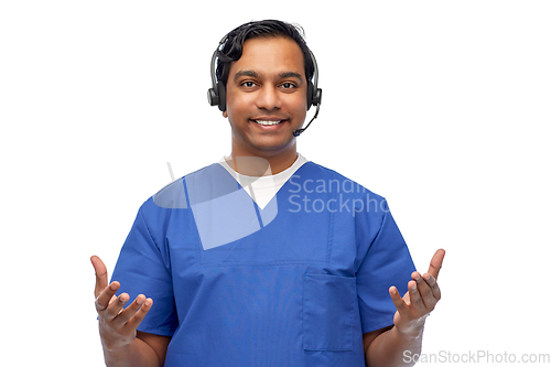 Image of smiling indian doctor or male nurse with headset