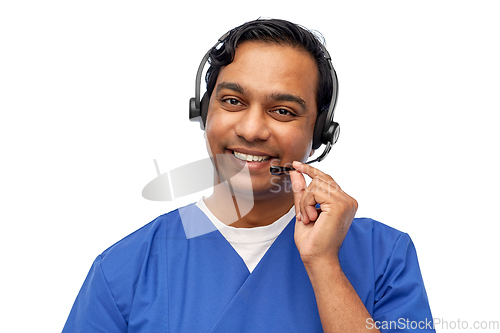 Image of smiling indian doctor or male nurse with headset