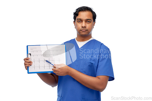 Image of male doctor with cardiogram on clipboard