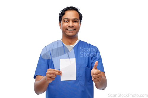 Image of indian doctor with prescription showing thumbs up