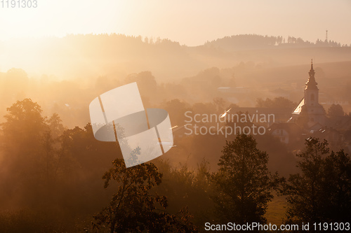 Image of Autumn foggy sunrise landscape