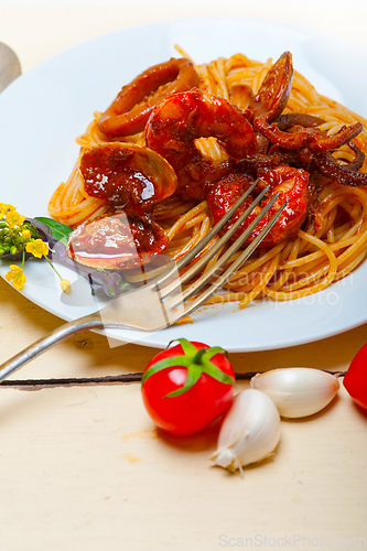 Image of Italian seafood spaghetti pasta on red tomato sauce