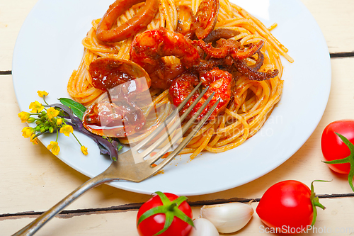 Image of Italian seafood spaghetti pasta on red tomato sauce