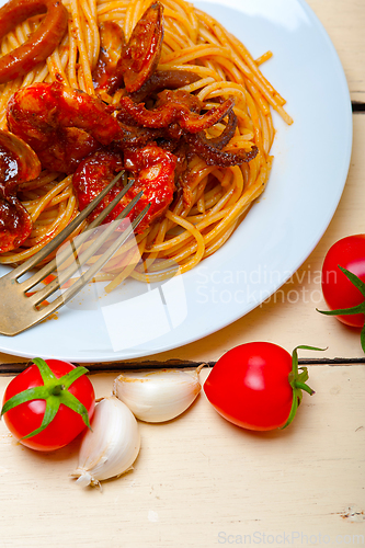 Image of Italian seafood spaghetti pasta on red tomato sauce