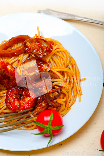 Image of Italian seafood spaghetti pasta on red tomato sauce