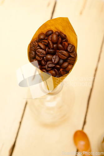 Image of espresso coffee beans on a paper cone