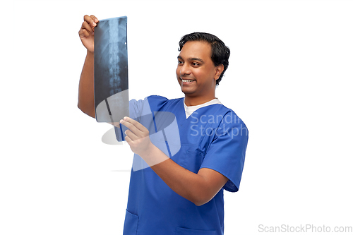 Image of happy indian doctor or male nurse with x-ray